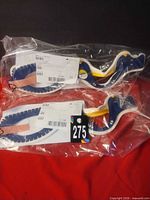 Two sealed pediatric cervical collars in packaging with lot label visible