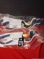 Two sealed pediatric Stifneck Select collars in bags with labels visible