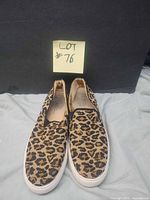 Front view of both flats showing leopard print uppers