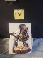 figurine wrapped in original styrofoam packaging