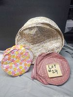 Three round floral tote bags, varying sizes and colours