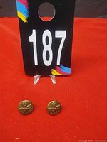 Pair of RCAF buttons front view beside lot number card
