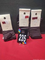 Three tagged pairs of Zara striped socks front view
