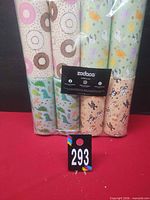 Front view of sealed 8-pack tissue tubes showing assorted designs