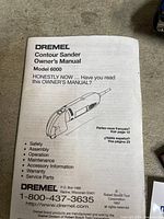 Owner’s manual cover showing Dremel Contour Sander Model 6000