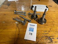 Group of Forstner bits on workbench with tag 78