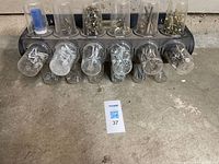 Front view of organizer showing 14 clear cups filled with fasteners