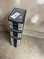 Stack of five plastic drawer boxes showing overall lot