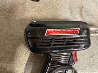 Side of Weller 8200 soldering gun showing model plate