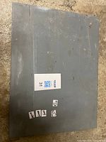 Top view of rectangular gray steel plate with measurement label