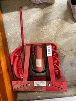 Top view of complete hydraulic pipe bender showing frame, jack, springs and dies