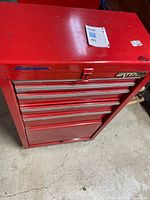 Front view of red Waterloo tool chest showing five drawers and lock