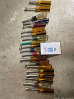 Full set of nut drivers lined on floor