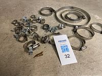 Group of small to large hose clamps with lot tag