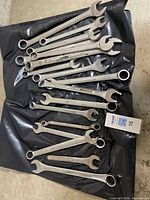 All wrenches laid out on black surface showing quantity and variety