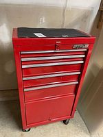 Front view of red Waterloo rolling tool cabinet on casters