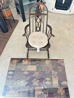 Top view of wooden armchair and area rug