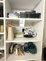 Shelf with shoe boxes, handbags and accessories