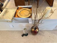Overall lot with charger plates box, striped box, vase with branches, pillar candle, lantern