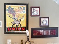 Wall with framed wine poster, two small prints, Merlot word art