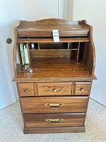 full view of small wooden roll-top desk with tambour open