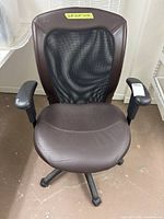 Front view of brown faux-leather and mesh desk chair