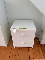 Front view of white two-drawer night table