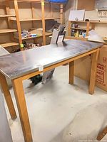 Full view of work table front and shelving behind