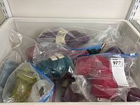 Overview of yarn balls in freezer basket style container