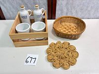 overview of all items: cruets, cups, crate, basket, trivet