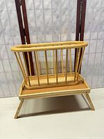 Magazine rack set atop folded tray to show both items together