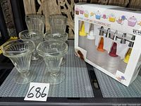 Overall lot view with glasses and boxed decorating set