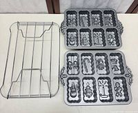 Two holiday mini loaf pans and cooling rack