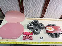 All items laid out with rulers for scale