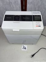 Front and side view of Panasonic SD-BT65P bread maker with power cord