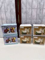 Six boxed Sakura salt & pepper shaker sets: three Apple Orchard, three Star Struck Animals