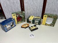 Lot overview showing boxed ceramic sets, Henny & Penny sugar & creamer box, two wooden animal-shaped picture frames