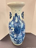 Full view of cobalt blue landscape porcelain baluster vase with handles