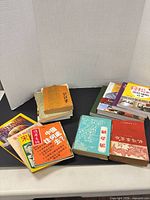 Overall lot showing multiple Chinese books, Jacques Pepin cookbook and other volumes
