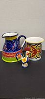 Pitcher, vase and rooster together displaying size and pattern