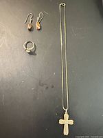 Group shot of necklace, earrings and ring