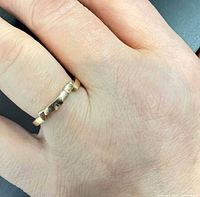 Ring on hand, showing design and scale