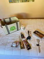 All items laid out on bed: tote, jar, utensils, timer, loaf pan