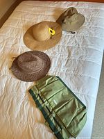 All three hats and folded garden tote displayed