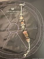 Full bracelet on Trollbeads pouch showing chain, clasp and beads