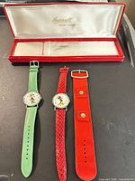 Two watches, spare strap and box overview