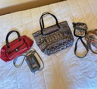 Five bags overview on bed