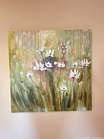 Square floral canvas painting hung on wall