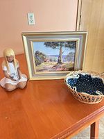 All three items: framed painting, figurine, basket
