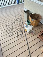 Overall lot showing planters, hooks, candles, watering can